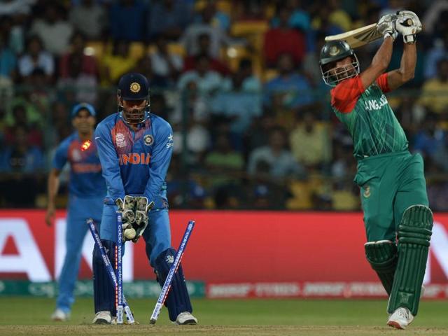 India's captain and wicketkeeper Mahendra Singh Dhoni looks on as Bangladesh's captain Mashrafe Bin Mortaza is bowled. (AFP Photo) India's captain and wicketkeeper Mahendra Singh Dhoni looks on as Bangladesh's captain Mashrafe Bin Mortaza is bowled. (AFP Photo)