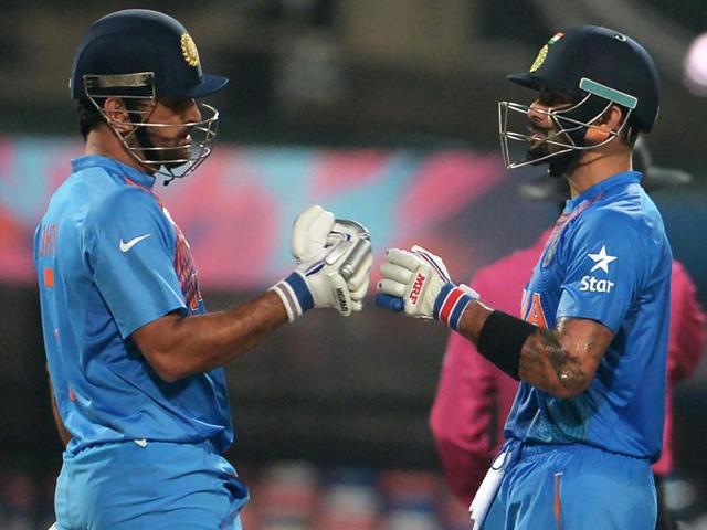 India's captain Mahendra Singh Dhoni and teammate Virat Kohli speak during the World T20 cricket tournament. (AFP Photo) India's captain Mahendra Singh Dhoni and teammate Virat Kohli speak during the World T20 cricket tournament. (AFP Photo)