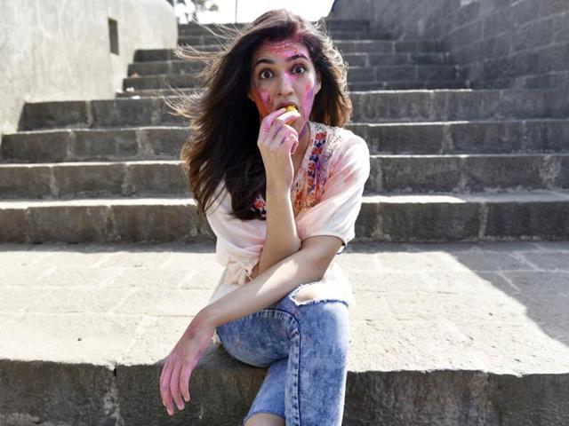 And now watch Kriti demolish the sweet. (Vidya Subramanian/HT photo) 