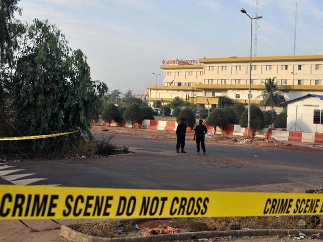Malian police personnel stand guard near a hotel hosting an EU military training mission a day after an attack in Bamako.(AFP) Malian police personnel stand guard near a hotel hosting an EU military training mission a day after an attack in Bamako.(AFP)