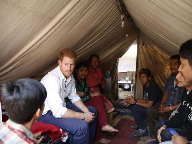 Britain’s Prince Harry visits Nepalese families displaced by the 2015 earthquakes at a makeshift camp in Bhaktapur on March 20, 2016. (AFP) Britain’s Prince Harry visits Nepalese families displaced by the 2015 earthquakes at a makeshift camp in Bhaktapur on March 20, 2016. (AFP)