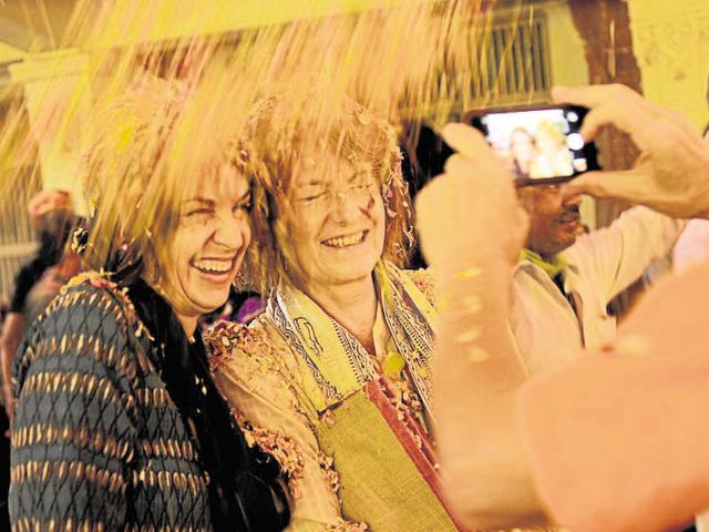 Thousands of foreign tourists come to Vrindavan to get a first-hand experience of the festival of colours. (Burhaan Kinu/HT Photo) Thousands of foreign tourists come to Vrindavan to get a first-hand experience of the festival of colours. (Burhaan Kinu/HT Photo)