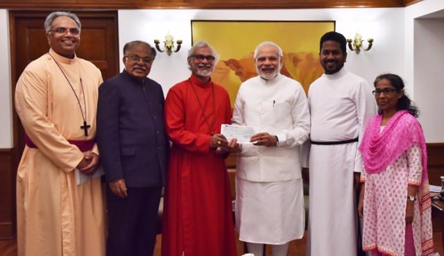Punnose (C) met the Prime Minister earlier in March. (HT Photo) Punnose (C) met the Prime Minister earlier in March. (HT Photo)