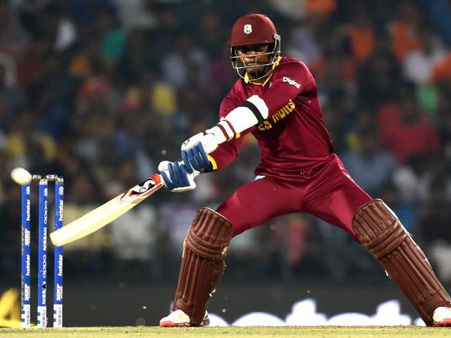 West Indies player Marlon Samuels hits a shot. Samuels top scored for the Windies with a run-a-ball 44. (Kunal Patil/HT Photo) West Indies player Marlon Samuels hits a shot. Samuels top scored for the Windies with a run-a-ball 44. (Kunal Patil/HT Photo)