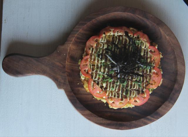 There is so much crunch in the okonomiyaki that a meal of the zesty sauce-glazed pancake wouldn’t feel monotonous. (Pramod Thakur/HT Photo)