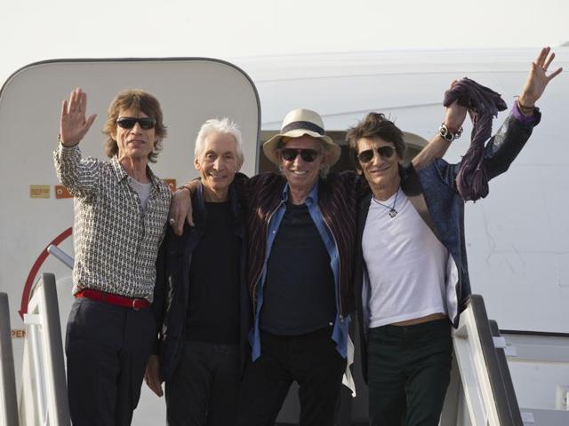 Members of The Rolling Stones, from, Mick Jagger, Charlie Watts, Keith Richards and Ron Wood pose for photos from the plane that brought them to Cuba at Jose Marti international airport in Havana. (AP Photo) Members of The Rolling Stones, from, Mick Jagger, Charlie Watts, Keith Richards and Ron Wood pose for photos from the plane that brought them to Cuba at Jose Marti international airport in Havana. (AP Photo)