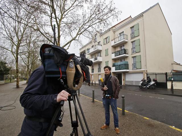 Journalists gathering in front of the house were French police where searching on Thursday night in Argenteuil, northern outskirts of Paris. (AP) Journalists gathering in front of the house were French police where searching on Thursday night in Argenteuil, northern outskirts of Paris. (AP)