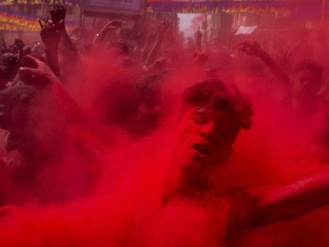 Revellers enjoying rain of coloured water during traditional holi celebration. (Hindustan Times) Revellers enjoying rain of coloured water during traditional holi celebration. (Hindustan Times)