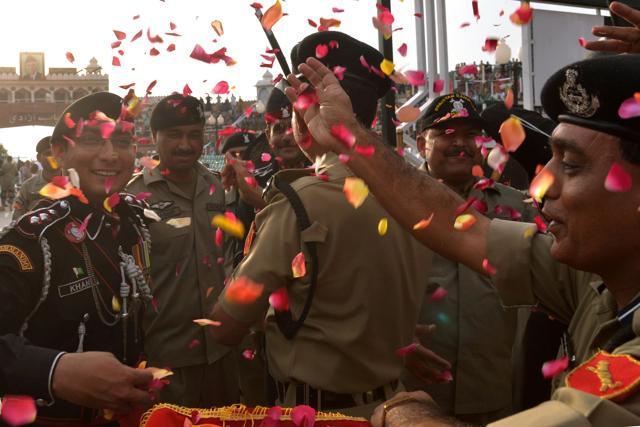 Border Security Force (BSF) personnel along with Pakistani Rangers celebrate the Holi festival with flower petals. (AFP Photo) Border Security Force (BSF) personnel along with Pakistani Rangers celebrate the Holi festival with flower petals. (AFP Photo)