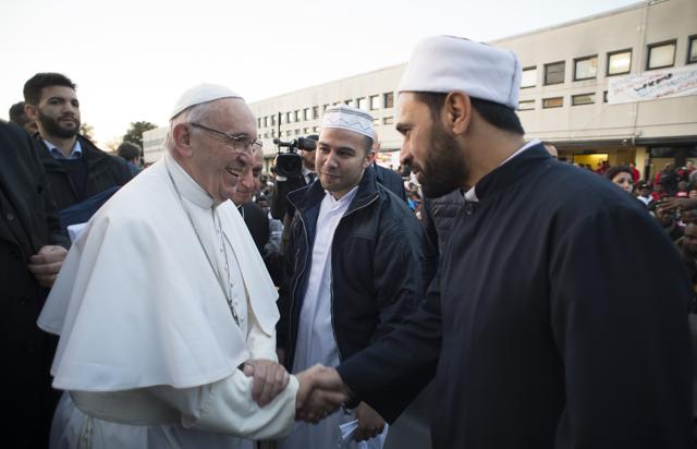 Pope Francis shakes hands with Muslims faithful during his visit at the Castelnuovo di Porto refugees centre, some 30km (18, 6 miles) from Rome, Thursday, March 24, 2016. (AP Photo) Pope Francis shakes hands with Muslims faithful during his visit at the Castelnuovo di Porto refugees centre, some 30km (18, 6 miles) from Rome, Thursday, March 24, 2016. (AP Photo)