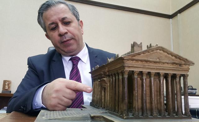 Syria's antiquities chief Maamoun Abdelkarim points at a model of the Bel Temple which was destroyed by the Islamic State (IS) group in the ancient city of Palmyra. (AFP) Syria's antiquities chief Maamoun Abdelkarim points at a model of the Bel Temple which was destroyed by the Islamic State (IS) group in the ancient city of Palmyra. (AFP)