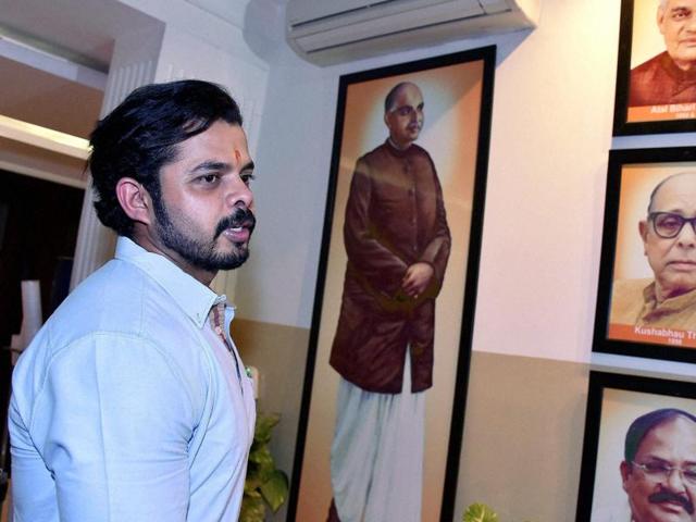BJP president Amit Shah with S Sreesanth during a meeting at the party office in New Delhi.(PTI Photo)