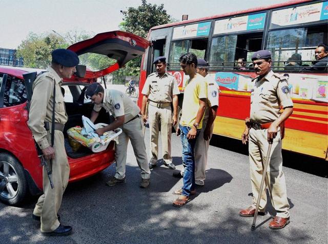 Gujarat police at a vehicle checkpoint. A State Human Rights Commission report has stated that there were 61 custodial deaths in the state during 2011-2012. (PTI Photo) Gujarat police at a vehicle checkpoint. A State Human Rights Commission report has stated that there were 61 custodial deaths in the state during 2011-2012. (PTI Photo)