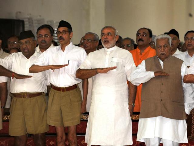 PM Narendra Modi (third left) and former chief minister of Gujarat Keshubhai Patel (second right, front) at an RSS gathering near Ahmedabad in September 2009. (AFP) PM Narendra Modi (third left) and former chief minister of Gujarat Keshubhai Patel (second right, front) at an RSS gathering near Ahmedabad in September 2009. (AFP)