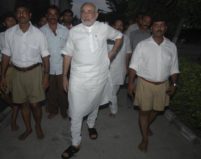 Narendra Modi after a meeting with RSS chief Mohan Bhagwat at a temple in Adalaj, about 20 kilometers north of Ahmadabad in September 2009. (AP) Narendra Modi after a meeting with RSS chief Mohan Bhagwat at a temple in Adalaj, about 20 kilometers north of Ahmadabad in September 2009. (AP)