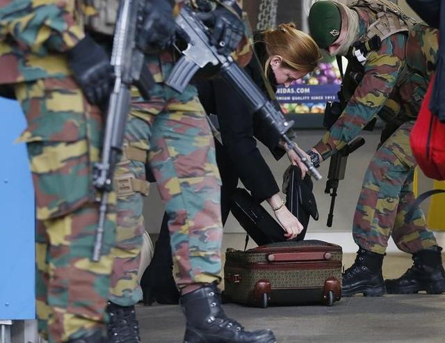 A woman's baggage is searched by soldiers at the entrace to a Brussels subway station following Tuesday's bombings in Brussels, Belgium, March 25, 2016. (Reuters) A woman's baggage is searched by soldiers at the entrace to a Brussels subway station following Tuesday's bombings in Brussels, Belgium, March 25, 2016. (Reuters)