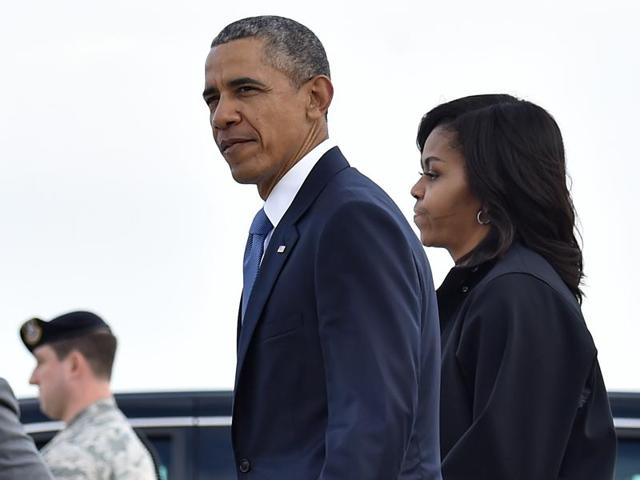 US President Barack Obama and First Lady Michelle Obama walk to their limousine at Andrews Air Force Base in Maryland on Friday upon their return from a four-day trip to Cuba and Argentina. (AFP) US President Barack Obama and First Lady Michelle Obama walk to their limousine at Andrews Air Force Base in Maryland on Friday upon their return from a four-day trip to Cuba and Argentina. (AFP)