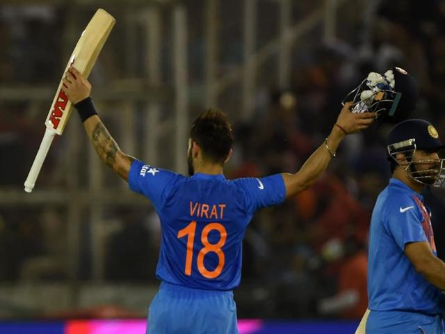 India's captain Mahendra Singh Dhoni(R) walks with teammate Virat Kohli as they celebrate after victory. (AFP Photo) India's captain Mahendra Singh Dhoni(R) walks with teammate Virat Kohli as they celebrate after victory. (AFP Photo)