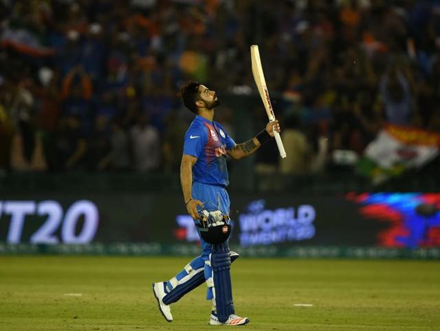 Kohli raises his bat as he walks off the field. (AFP) 