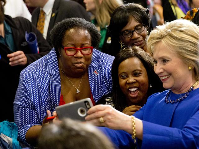 Democratic presidential candidate Hillary Clinton takes pictures with supporters after a campaign event. (AP Photo) Democratic presidential candidate Hillary Clinton takes pictures with supporters after a campaign event. (AP Photo)