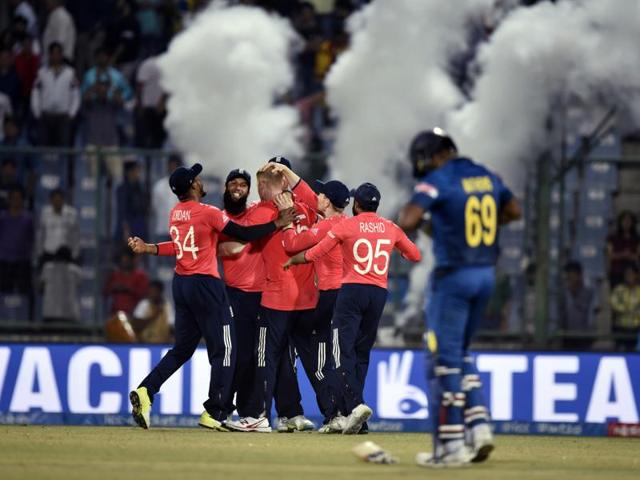 England team members celebrate after their win, which took them into the semifinals of the World T20. (Sanjeev Verma/HT Photo) 