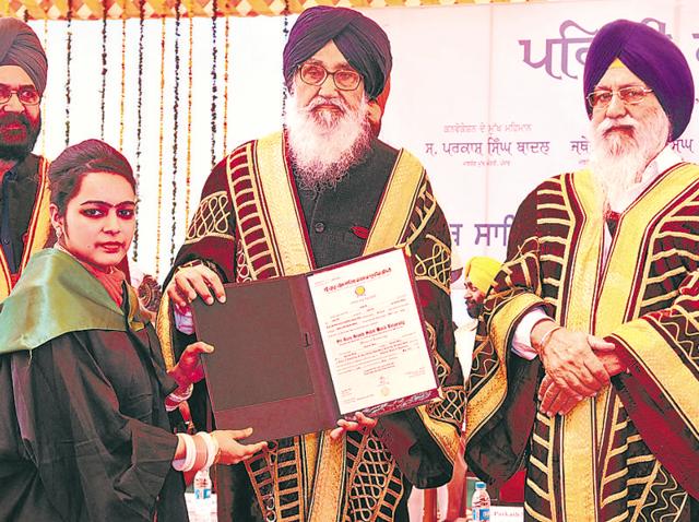 A student collecting her degree from Punjab chief minister Parkash Singh Badal during the first annual convocation of Sri Guru Granth Sahib World University in Fatehgarh Sahib on Saturday, as Shiromani Gurdwara Parbandhak Committee president Avtar Singh Makkar (right) looks on. (Bharat Bhushan/HT) A student collecting her degree from Punjab chief minister Parkash Singh Badal during the first annual convocation of Sri Guru Granth Sahib World University in Fatehgarh Sahib on Saturday, as Shiromani Gurdwara Parbandhak Committee president Avtar Singh Makkar (right) looks on. (Bharat Bhushan/HT)