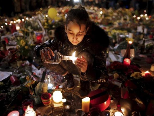 Belgian soldiers patrol as people pay tribute to the victims of Tuesday's bomb attacks at the Place de la Bourse in Brussels. (REUTERS) Belgian soldiers patrol as people pay tribute to the victims of Tuesday's bomb attacks at the Place de la Bourse in Brussels. (REUTERS)