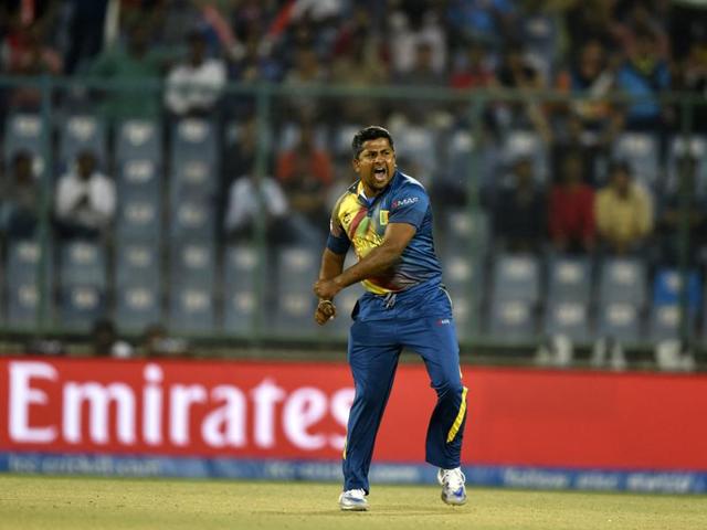 Sri Lanka’s Rangana Herath celebrates after dismissing England’s Alex Hales. (Sanjeev Verma/HT Photo) 