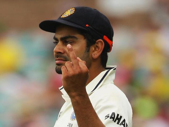 Kohli getting into trouble? No! Kohli was captured gesturing with his middle finger to the crowd during day two of the Second Test Match between Australia and India at the Sydney Cricket Ground on January 4, 2012 . (Getty Images) Kohli getting into trouble? No! Kohli was captured gesturing with his middle finger to the crowd during day two of the Second Test Match between Australia and India at the Sydney Cricket Ground on January 4, 2012 . (Getty Images)