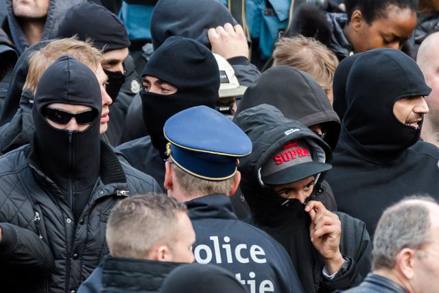 Right wing demonstrators talk with a police man during their protest in Brussels. (AP Photo) Right wing demonstrators talk with a police man during their protest in Brussels. (AP Photo)