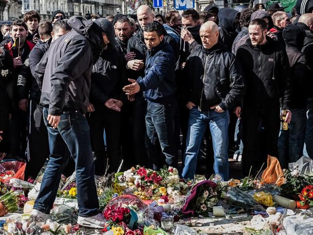 Right wing demonstrators protest at a memorial site at the Place de la Bourse in Brussels, Sunday, March 27, 2016.(AP Photo)
