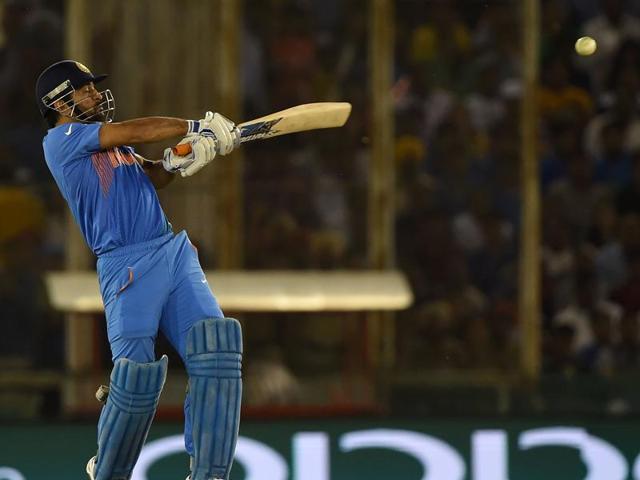 Dhoni plays a pull shot. (AFP) 
