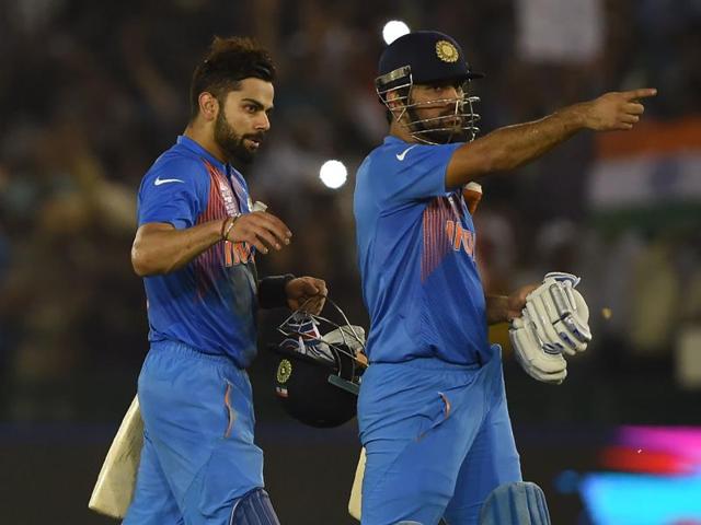 India's Virat Kohli (L) embraces captain Mahendra Singh Dhoni as he celebrates after victory.(AFP)