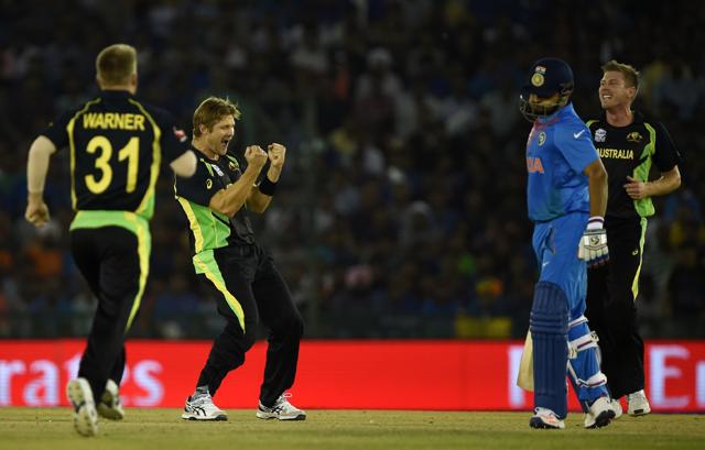 Australia's Shane Watson(2L) gestures as he celebrates with teammates Australia's David Warner(L) and James Faulkner(R)after his dismissal of India's Suresh Raina(2R). (AFP) Australia's Shane Watson(2L) gestures as he celebrates with teammates Australia's David Warner(L) and James Faulkner(R)after his dismissal of India's Suresh Raina(2R). (AFP)