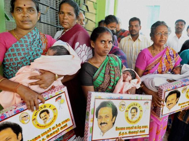 DMK members gift gold chains and baby-sets to the newly born babies in a hospital on DMK Treasurer MK Stalin’s 64th birthday in Coimbatore (PTI) DMK members gift gold chains and baby-sets to the newly born babies in a hospital on DMK Treasurer MK Stalin’s 64th birthday in Coimbatore (PTI)