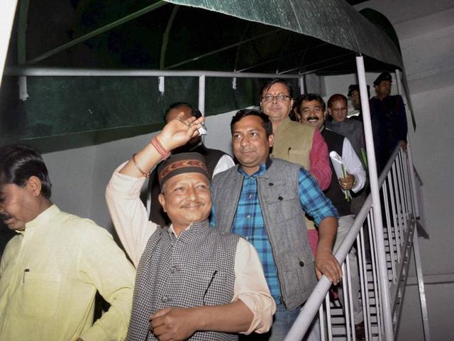 Rebel Congress MLAs, a BSP legislator and the representatives of BJP after meeting the governor of Uttarakhand KK Paul at his residence in Dehradun on Friday, March 19, 2016. (PTI)