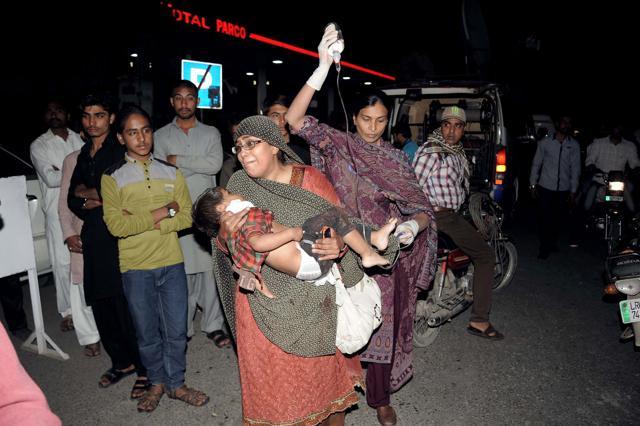 Relatives bring an injured child to the hospital in Lahore. (AFP Photo) Relatives bring an injured child to the hospital in Lahore. (AFP Photo)