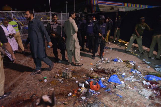 Pakistani rescuers and officials gather at a bomb blast site in Lahore. (AFP Photo) Pakistani rescuers and officials gather at a bomb blast site in Lahore. (AFP Photo)