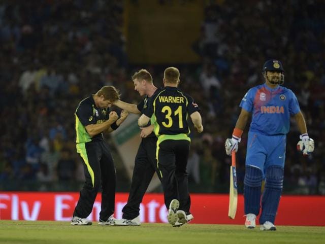 Shane Watson celebrates with teammates the dismissal of Suresh Raina. (Ravi Kumar/HT Photo) 