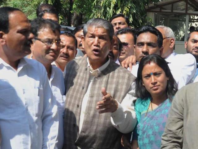 Deposed chief minister Harish Rawat along with Congress leaders and MLAs after meeting Uttarakhand governor KK Paul at Raj Bhawan in Dehradun. (PTI) Deposed chief minister Harish Rawat along with Congress leaders and MLAs after meeting Uttarakhand governor KK Paul at Raj Bhawan in Dehradun. (PTI)