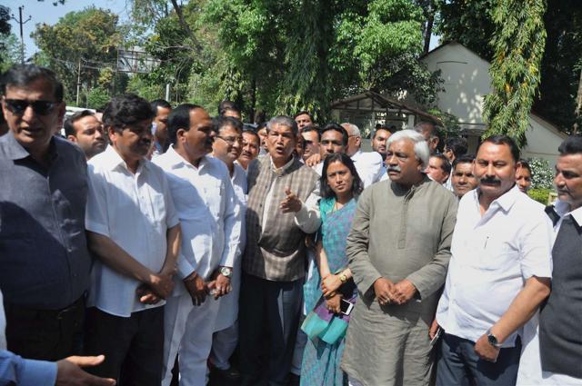 Harish Rawat (centre) along with Congress leaders and MLAs after meeting Uttarakhand governor KK Paul at Raj Bhawan in Dehradun on Monday. (PTI) Harish Rawat (centre) along with Congress leaders and MLAs after meeting Uttarakhand governor KK Paul at Raj Bhawan in Dehradun on Monday. (PTI)