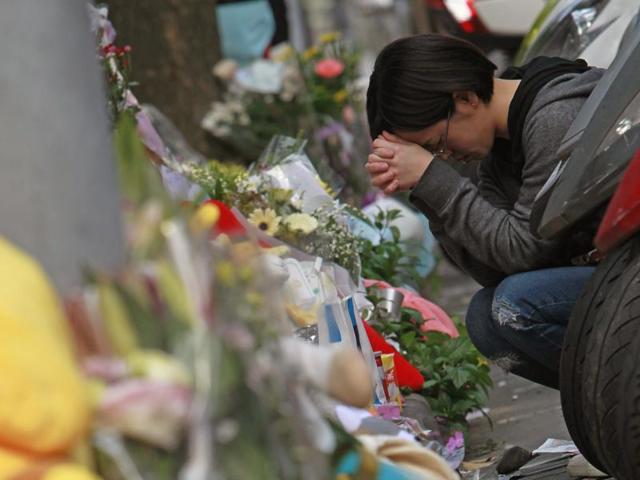 A man (C) who allegedly attacked and murdered a Taiwanese toddler along a street in Taipei, sending shock waves through the island. (AFP) A man (C) who allegedly attacked and murdered a Taiwanese toddler along a street in Taipei, sending shock waves through the island. (AFP)