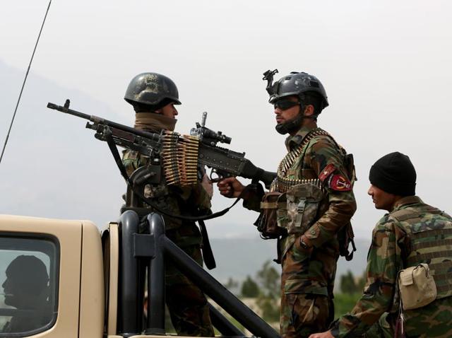 Afghan military soldiers stand alert at the entrance gate of the new parliament building after a rocket attack in Kabul, Afghanistan on Monday. The Taliban killed 15 Afghan soldiers during a firefight. (AP) Afghan military soldiers stand alert at the entrance gate of the new parliament building after a rocket attack in Kabul, Afghanistan on Monday. The Taliban killed 15 Afghan soldiers during a firefight. (AP)