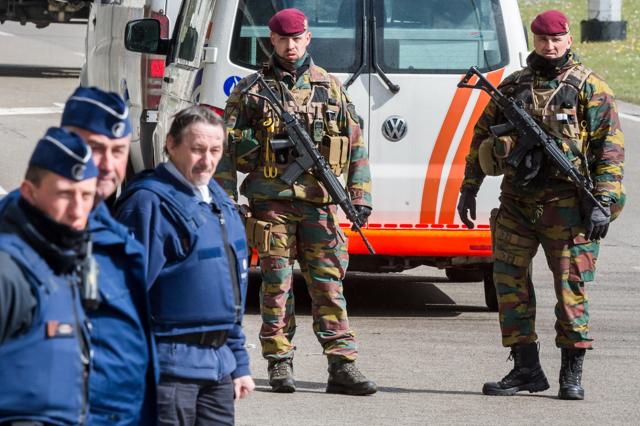 Belgian policemen and soldiers secure the area outside Zaventem Airport in Brussels. (AP) Belgian policemen and soldiers secure the area outside Zaventem Airport in Brussels. (AP)