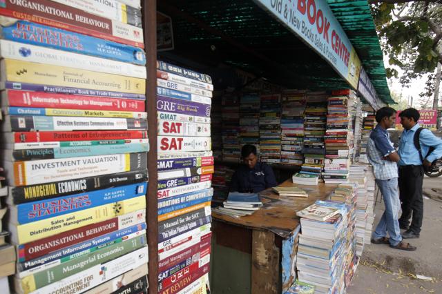 Situated opposite old JNU campus, in Ber Sarai market, are rows of shops that look like ordinary bookshops offering new and second-hand course material(Tribhuwan Sharma/ HT Photo)