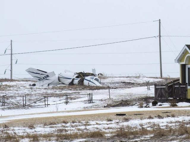 The wreckage of an airplane lies in a field in Havre-aux-Maison, Quebec. (AP) The wreckage of an airplane lies in a field in Havre-aux-Maison, Quebec. (AP)