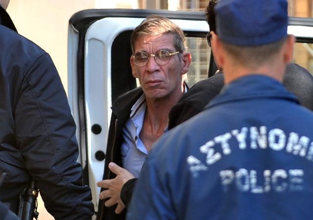 Seif al-Din Mohamed Mostafa is brought by policemen to court. (AFP Photo) Seif al-Din Mohamed Mostafa is brought by policemen to court. (AFP Photo)