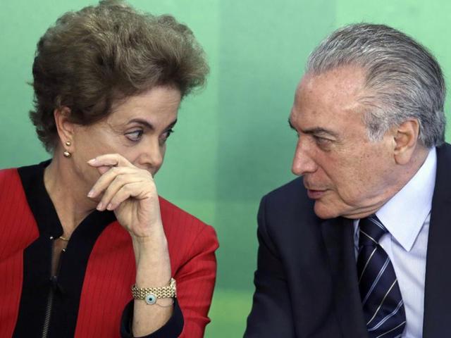 File photo of Brazil’s President Dilma Rousseff talks with her Vice President Michel Temer. The Brazilian Democratic Movement Party, (PMDB), of which Temer is the leader, said on Tuesday, March 29, 2016, that its members are leaving Rousseff's governing coalition. (AP) File photo of Brazil’s President Dilma Rousseff talks with her Vice President Michel Temer. The Brazilian Democratic Movement Party, (PMDB), of which Temer is the leader, said on Tuesday, March 29, 2016, that its members are leaving Rousseff's governing coalition. (AP)