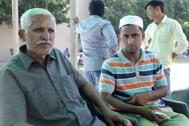 (From left) Mohammad Ikhlaq’s brother Afzaal Ahmad with the victim’s son Sartaj Ahmad in Greater Noida. They say they won’t return to Bisada village where Ikhlaq was lynched. (Sunil Ghosh / HT Photo ) (From left) Mohammad Ikhlaq’s brother Afzaal Ahmad with the victim’s son Sartaj Ahmad in Greater Noida. They say they won’t return to Bisada village where Ikhlaq was lynched. (Sunil Ghosh / HT Photo )