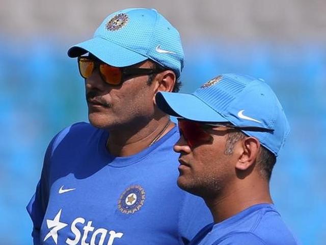 India's captain Mahendra Singh Dhoni (R) talks to his Team Director Ravi Shastri. (Reuters Photo) India's captain Mahendra Singh Dhoni (R) talks to his Team Director Ravi Shastri. (Reuters Photo)